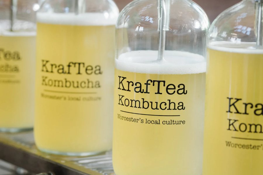 KrafTea Kombucha bottles being filled on the bottling line