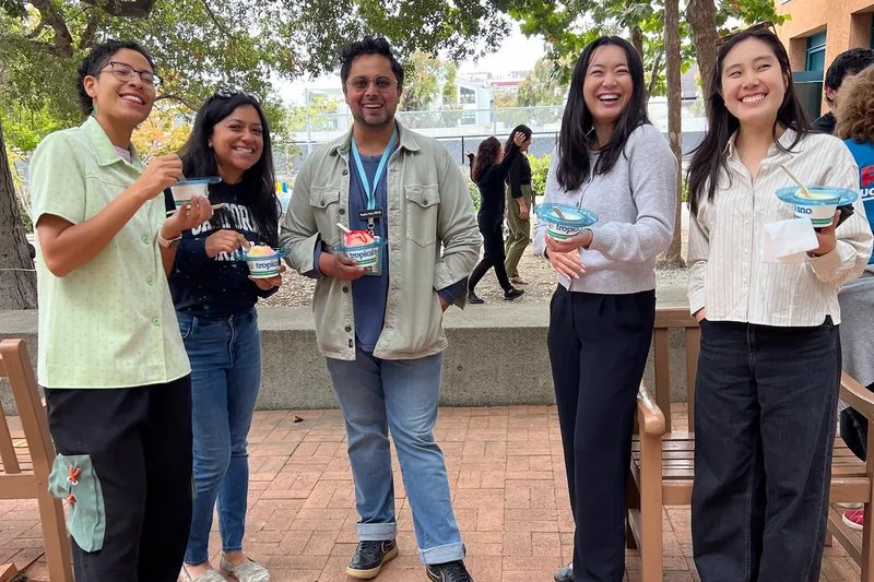 Guests holding cups of Tropics shave ice at a corporate campus event