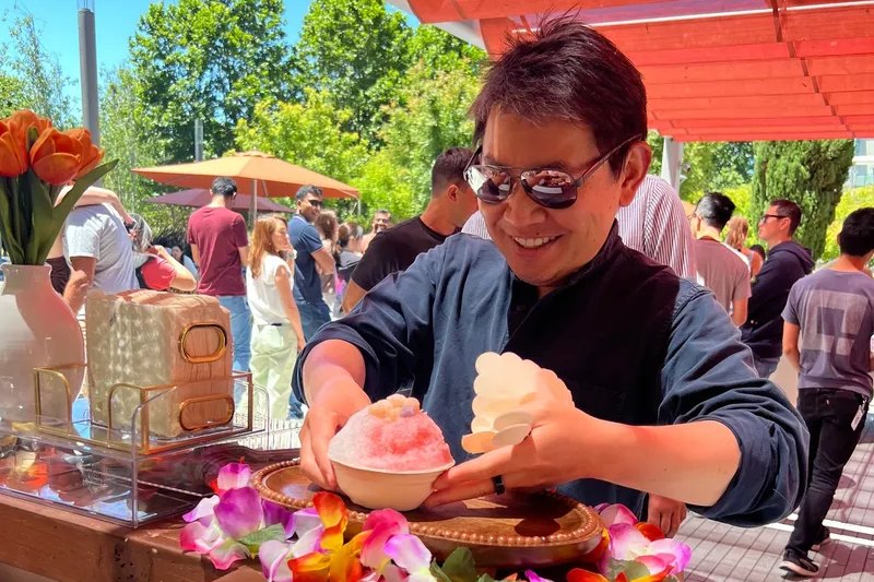 Shave ice being served at an outdoor corporate event