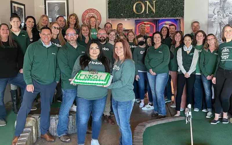 A company team celebrating an event at Old Town Putt